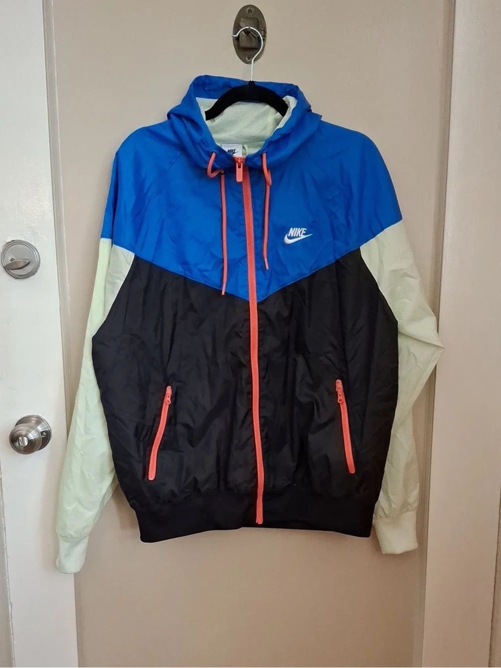 Nike Men’s Blue/Black/Cream Windbreaker with Coral Accents